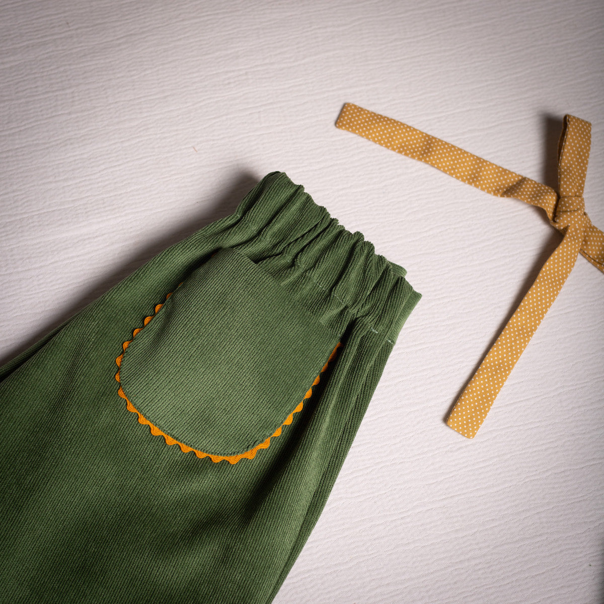 Olive corduroy embroidered bell bottom pants
