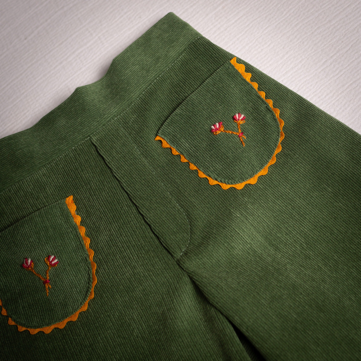 Olive corduroy embroidered bell bottom pants