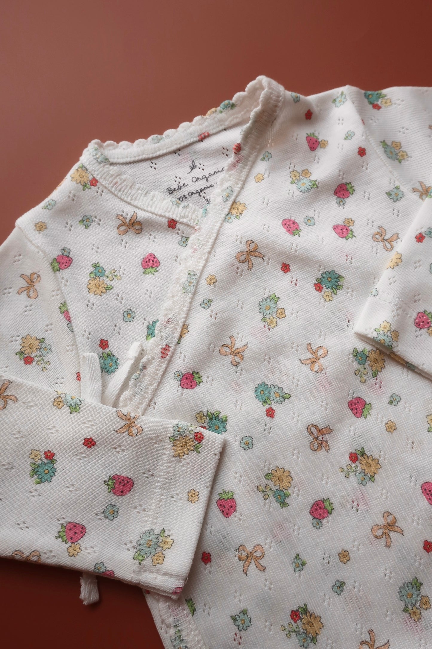 Nia Wrap Onesie/Strawberry Field